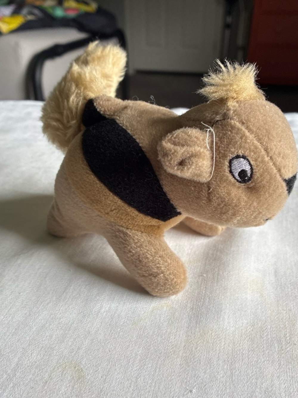 Plush Squeaky Puppy Toy in Brown with Black Accents